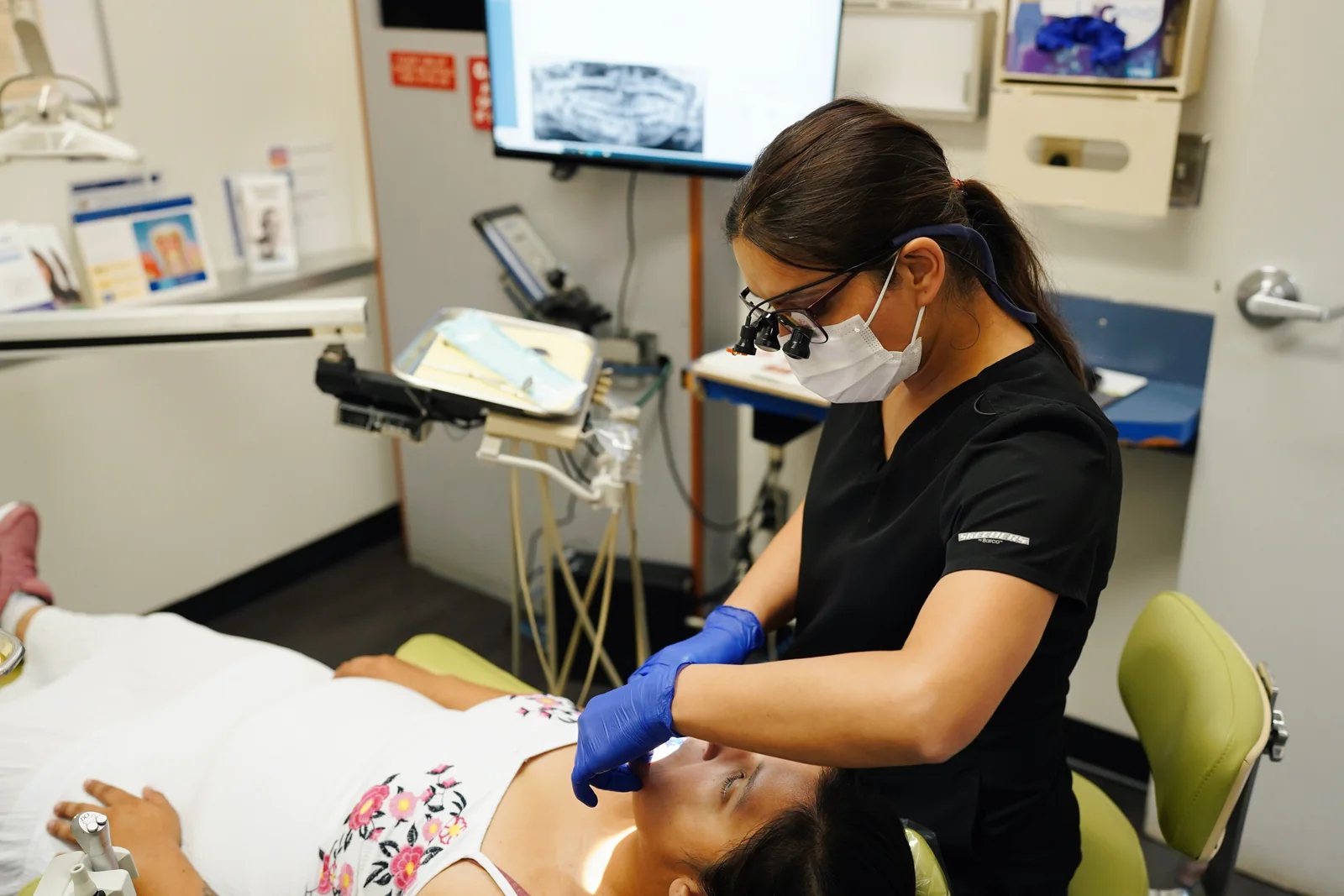 Dr. Kingra providing dental care